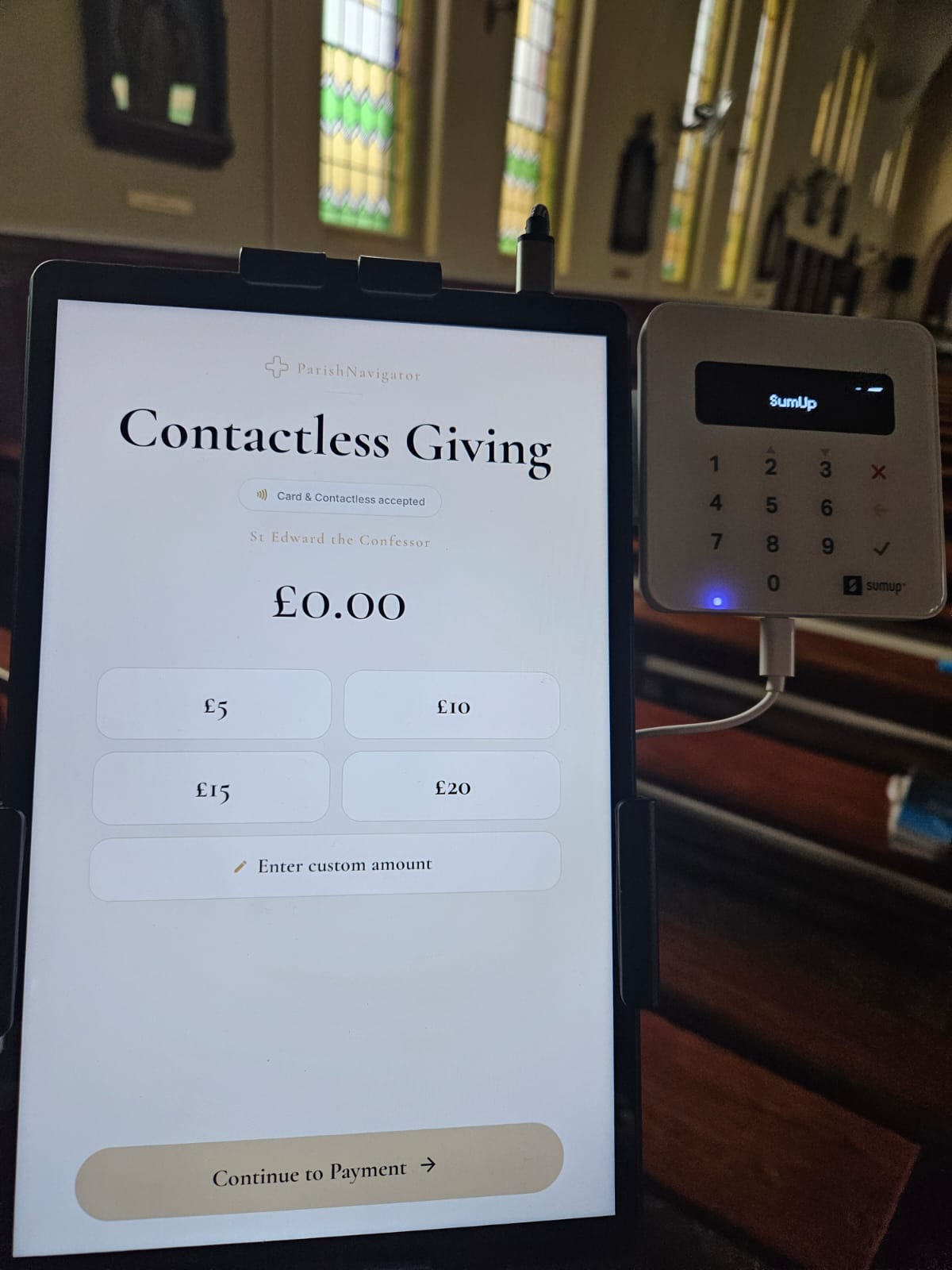 ParishNavigator contactless giving stand displayed inside a church.